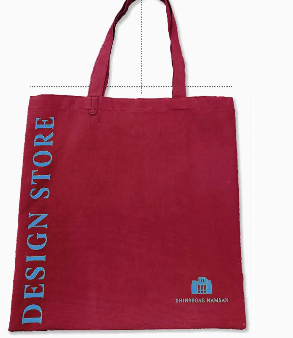 Design Store tote bag in mulberry red with blue lettering, with its dimensions